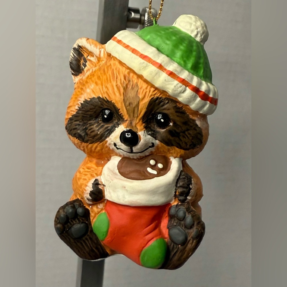 Enesco Critter Sitter ...raccoon holding a Christmas stocking